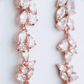 Cubic zirconia rose gold drop earrings closeup product photo