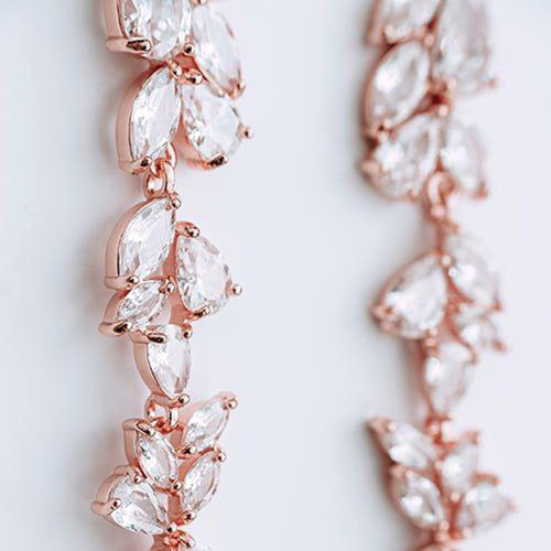 Cubic zirconia rose gold drop earrings closeup product photo